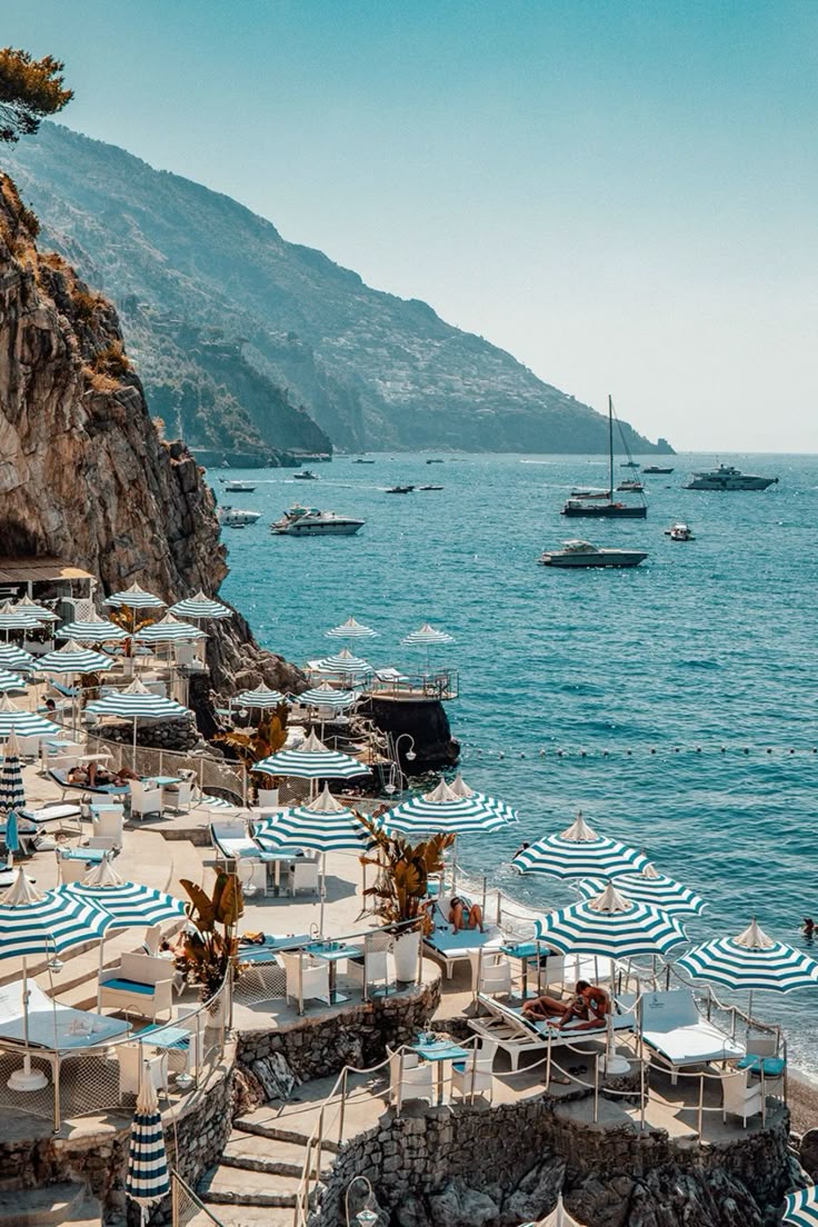 Luxury beach club overlooking the Amalfi Coast with Mediterranean travel and refined coastal atmosphere