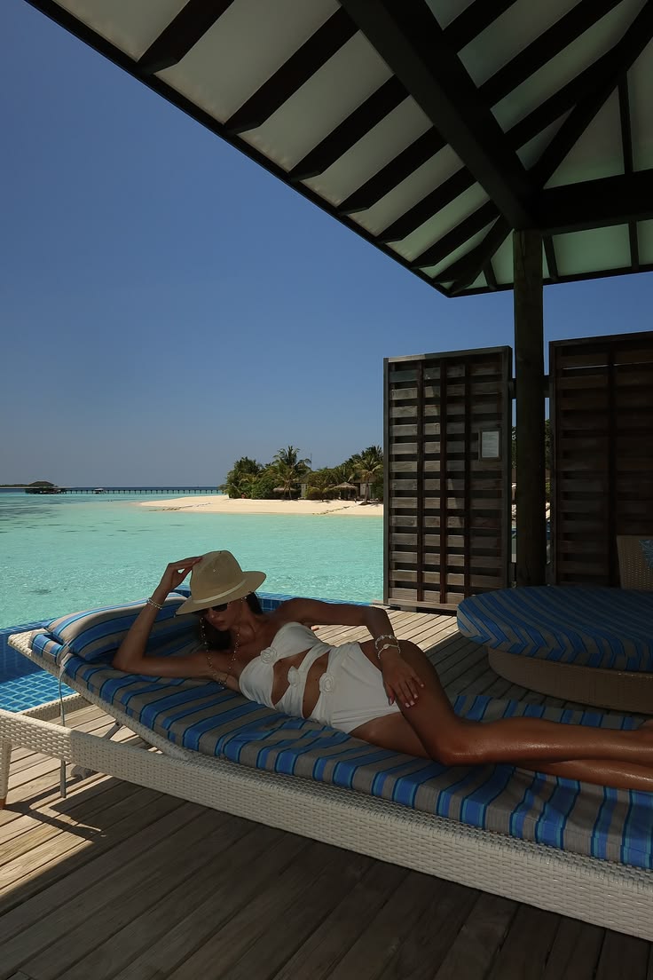 Luxury overwater villa terrace in the Maldives overlooking turquoise ocean and private island surroundings